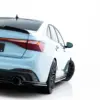 pol_po_Rear-Side-Splitters-Volkswagen-Jetta-GLI-Mk7-Facelift-2-23932_3webp - OPSHOLDERS Rear three-quarter view of a light-blue VW GLI with a red taillight bar and sporty rear bumper on a white background