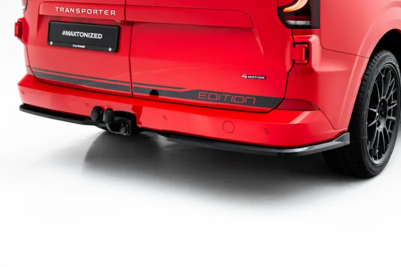 pol_po_Rear-Side-Splitters-Volkswagen-Transporter-T7-23936_4webp - OPSHOLDERS Rear view of a red vehicle showing a black license plate area with '#MAXTONIZED' and 'Edition' badge, 4MOTION emblem, and tow hitch visible under the bumper