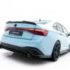 pol_po_Rear-Splitter-for-Volkswagen-Jetta-GLI-Mk7-Facelift-2-23931_2webp - OPSHOLDERS Rear-right view of a light-blue sports hatchback with a spoiler and dual exhausts.
