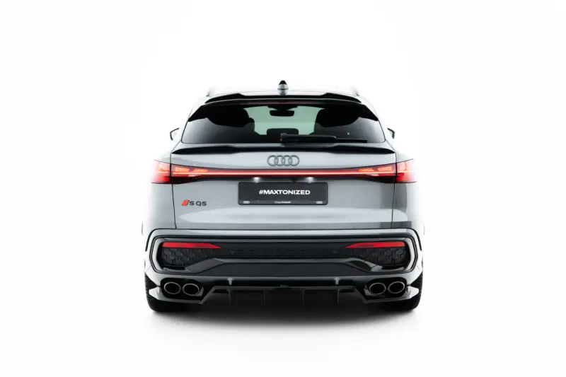 Rear view of a white Audi SQ5, showing red tail lights and a #MAXTONIZED license plate on the trunk edge.