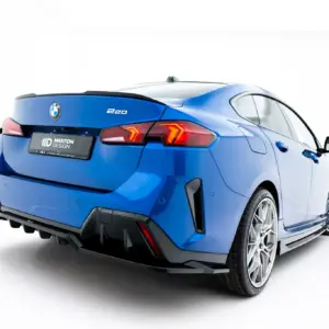 Blue BMW 220 rear quarter view with distinctive taillights and alloy wheels, showing the trunk and rear bumper surface.