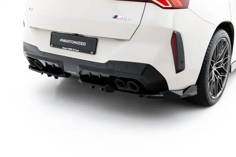 pol_po_Rear-Splitter-with-vertical-bars-BMW-X3-M50-G45-23898_1webp - OPSHOLDERS Rear view of a white BMW with M50 badge, visible taillight, large rear bumper, quad exhausts and a #MAXTONIZED license plate.