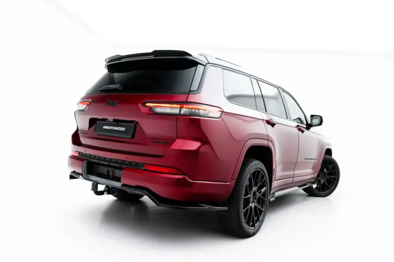 pol_po_Rear-Splitter-with-vertical-bars-Jeep-Grand-Cherokee-L-Mk5-23903_1webp - OPSHOLDERS Rear three-quarter view of a red Jeep SUV showing taillights, large black wheels, and a rear spoiler against a white background. License plate reads '#MAXTONIZED'.