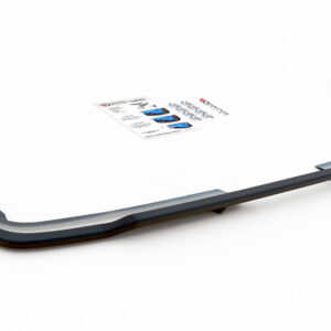 Metallic gray car roof rack frame on a white background with a small product brochure nearby.