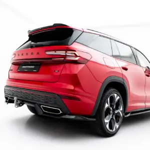 Red ŠKODA SUV shown from the rear-right angle, highlighting taillights, hatch, and alloy wheels