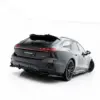 pol_po_Rear-Splitter-with-vertical-bars-V-3-Audi-A6-S-Line-C9-24006_2webp - OPSHOLDERS Rear three-quarter view of a dark gray Audi SUV in a white studio background, showing taillights and alloy wheels.