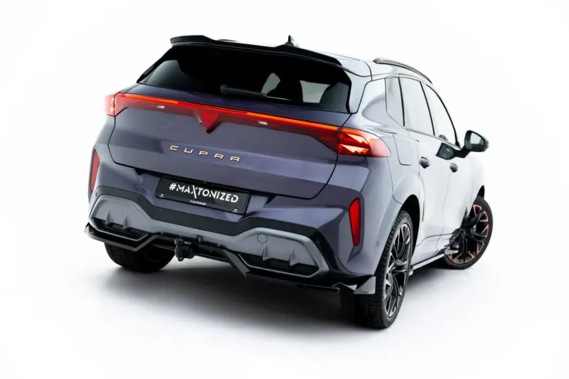 pol_po_Rear-Splitter-with-vertical-bars-V-3-Cupra-Terramar-Mk1-Version-with-towbar-23819_4webp - OPSHOLDERS Rear three-quarter view of a metallic gray Cupra SUV with a red LED tail light strip and a #MAXTONIZED license plate behind a sporty bumper edge.