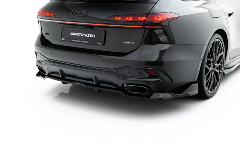 pol_po_Rear-Splitter-with-vertical-bars-V-4-Audi-A6-S-Line-C9-24007_6webp - OPSHOLDERS Rear view of a dark Audi A6 with red taillights and a license plate reading #MAXTONIZED, showing the quattro badge.