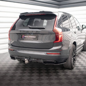 Rear view of a dark gray Volvo SUV in a studio setting, displaying a customized '#MAXTONIZED' plate and red taillights