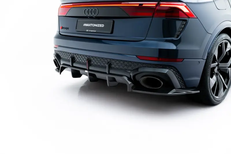 pol_po_Set-of-Prepreg-Carbon-Fiber-Splitters-Audi-RSQ8-Mk1-Facelift-23818_1webp - OPSHOLDERS Rear view of a dark blue Audi SUV showing red taillights, the RS Q8 badge, and a license plate reading #MAXTONIZED.