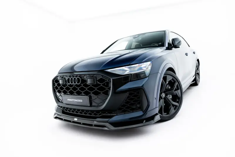 pol_po_Set-of-Prepreg-Carbon-Fiber-Splitters-Audi-RSQ8-Mk1-Facelift-23818_20webp - OPSHOLDERS Front three-quarter view of a blue Audi SUV with a honeycomb grille in a bright studio setting