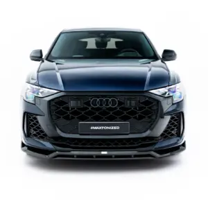 Front view of a dark blue SUV showing a large black grill and bumper, with a license plate reading #MAXTONIZED.