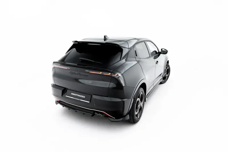 Rear three-quarter view of a dark gray luxury SUV with visible taillights and a '#MAXTONIZED' plate on a white background.