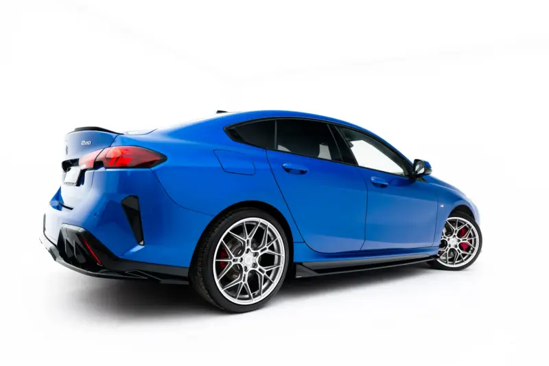 pol_po_Set-of-Splitters-BMW-2-M-Pack-Gran-Coupe-F74-23856_11webp - OPSHOLDERS Blue sports car shown from a rear-right angle with large silver alloy wheels on a white background.