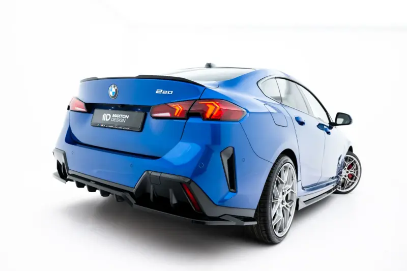 pol_po_Set-of-Splitters-BMW-2-M-Pack-Gran-Coupe-F74-23856_8webp - OPSHOLDERS Blue BMW 220 rear three-quarter view showing taillights, badge, and sporty design.