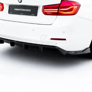 Rear view of a white BMW sedan, showing red tail lights and a black license plate with '#MAXTONIZED' text.