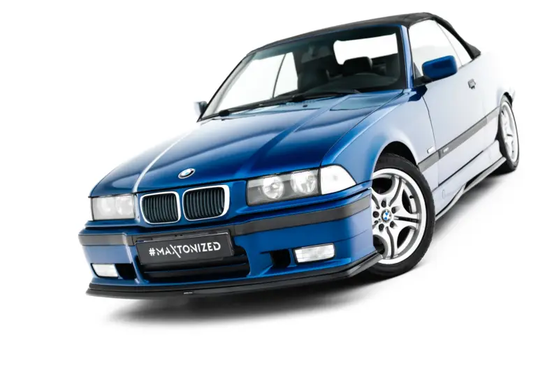 Blue BMW convertible angled toward the left, front bumper and hood visible, front plate reading #MAXTONIZED