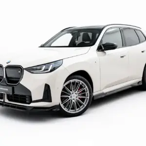 White BMW SUV shown from a front-left angle with large kidney grille and alloy wheels, in a studio setting.