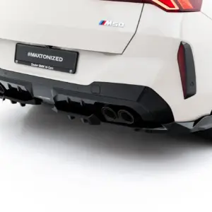 Rear view of a white BMW with M50 badge, black diffuser, quad exhausts, and a #MAXTONIZED plate.