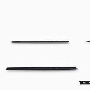 Disassembled black car trim pieces arranged in a rough circle on a white background, including long central rails and curved fender segments.