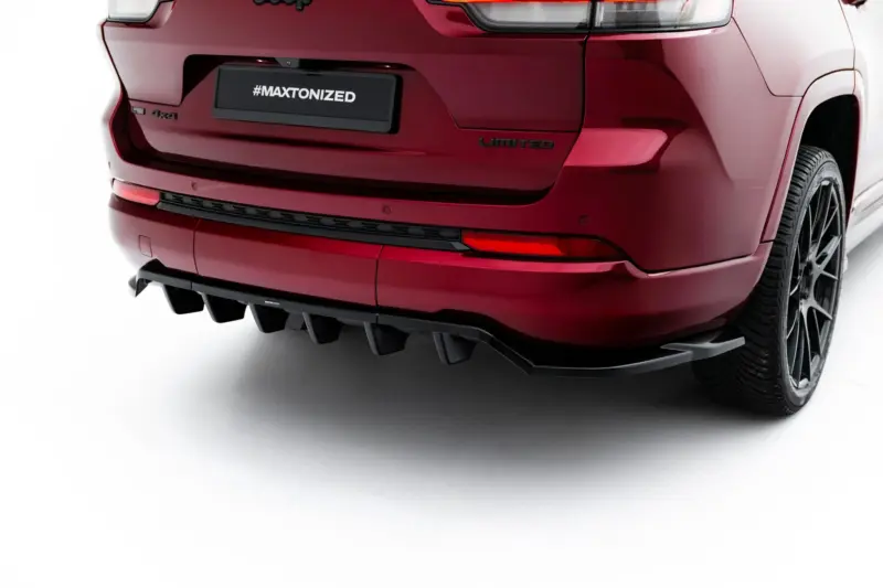 Rear view of a red SUV showing a black license plate with '#MAXTONIZED', and a 'Limited' badge on the tailgate.