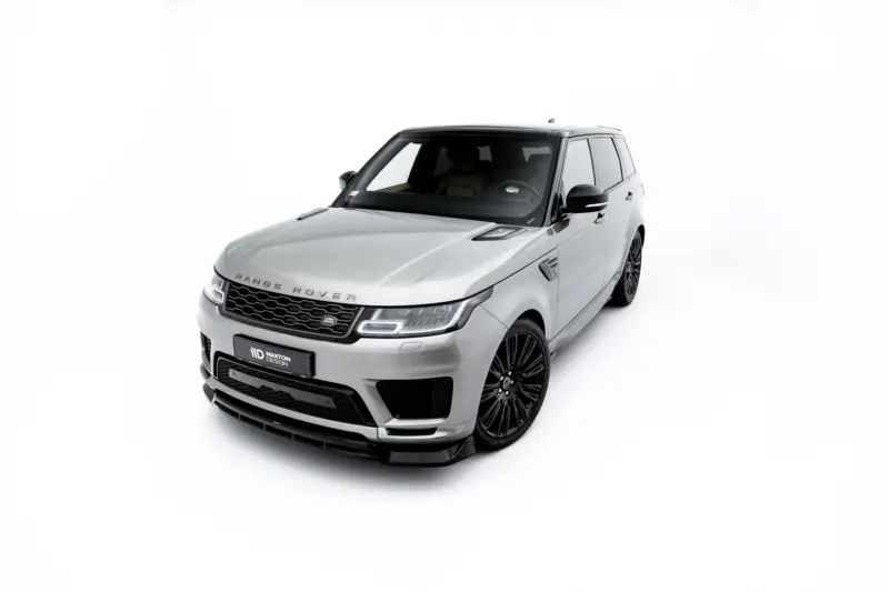pol_po_Set-of-Splitters-Land-Rover-Range-Rover-Sport-Mk2-Facelift-23834_17webp - OPSHOLDERS Front-left, three-quarter view of a silver Range Rover SUV in a bright white studio backdrop, showing grille and large black wheels.