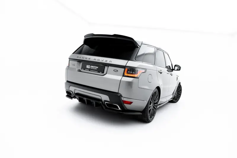 pol_po_Set-of-Splitters-Land-Rover-Range-Rover-Sport-Mk2-Facelift-23834_7webp - OPSHOLDERS Rear-right view of a silver Range Rover SUV in a bright studio setting, showing tail lights and rear design details.