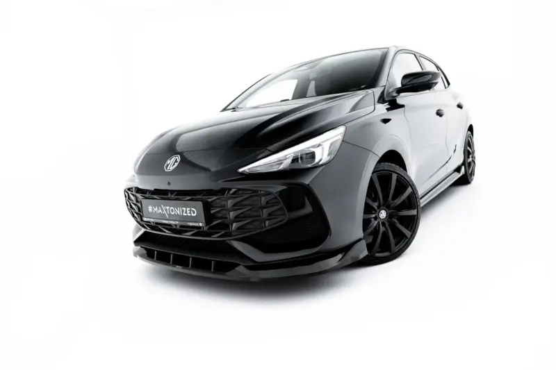 Front-left view of a sleek gray MG car with a bold grille and sharp headlights against a white studio backdrop.
