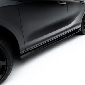 Side view of a dark gray car with glossy paint, showing the rear door and stylish black alloy wheel