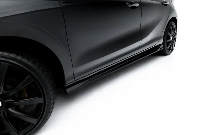Side view of a dark gray car with glossy paint, showing the rear door and stylish black alloy wheel