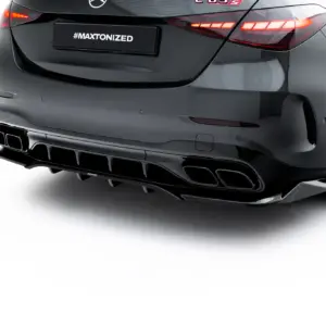 Rear view of a dark sports sedan with illuminated taillights and multiple exhausts; license plate reads #MAXTONIZED.