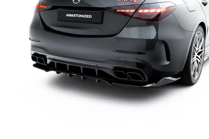pol_po_Set-of-Splitters-Mercedes-AMG-C63-Sedan-Estate-W206-S206-23828_13webp - OPSHOLDERS Rear view of a dark sports sedan with illuminated taillights and multiple exhausts; license plate reads #MAXTONIZED.