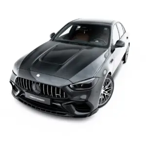 Front-left angled view of a dark gray Mercedes-Benz luxury car, highlighting the prominent vertical-slat grille and glossy finish.