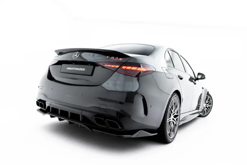 pol_po_Set-of-Splitters-Mercedes-AMG-C63-Sedan-Estate-W206-S206-23828_5webp - OPSHOLDERS Rear three-quarters view of a gray Mercedes-Benz with red taillights and a '#MAXTONIZED' plate area, showing a sporty rear diffuser and wheels.