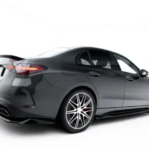 Rear three-quarter view of a dark gray luxury coupe with large multi-spoke wheels against a white studio background.