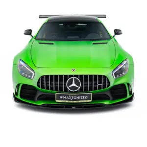 Front view of a neon green Mercedes AMG sports car with a large grille and #MAXTONIZED license plate on the bumper, facing forward.