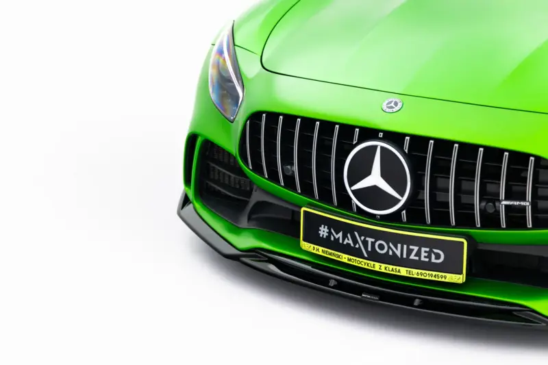 pol_po_Set-of-Splitters-Mercedes-AMG-GT-R-C190-Facelift-23894_2webp - OPSHOLDERS Bright green Mercedes front close-up showing the grille, emblem, and a yellow plate reading '#MAXTONIZED' on a white background image area nearby.