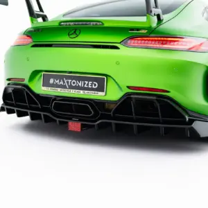Rear view of a bright green Mercedes sports car, showing taillights, diffuser, and a license plate reading #MAXTONIZED
