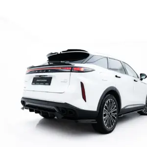 Rear three-quarter view of a white SUV with a black roof rack on a white studio backdrop, showing distinctive tail lights and large alloy wheels.