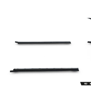 Disassembled black Maxton Design car body kit pieces laid out on a white background (side skirts, center underspoiler bars, and curved sections).