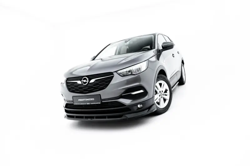 Front-left angle of a gray Opel car against a white studio background, showcasing the grille and headlights. Soothing, high-contrast image for a car ad.
