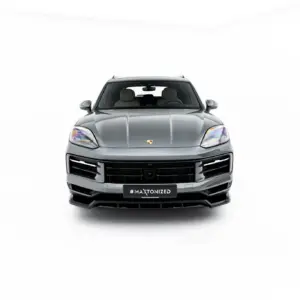 Front view of a silver Porsche SUV (Cayenne) facing the camera, with #MAXTONIZED plate visible on the grille badge area.