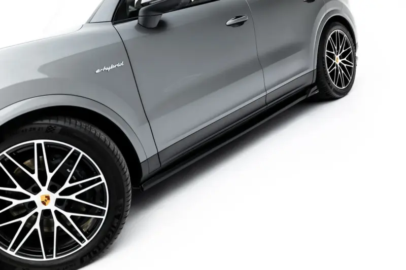 pol_po_Set-of-Splitters-Porsche-Cayenne-SUV-Mk3-Facelift-23886_3webp - OPSHOLDERS Side view of a gray Porsche SUV with the 'e-hybrid' badge and large multi-spoke wheels, cropped along the door and wheel area.