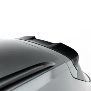 Close-up of a sleek car's rear section showing a spoiler and smooth metallic surface in a grayscale view.