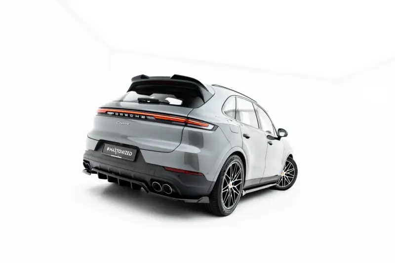 pol_po_Set-of-Splitters-Porsche-Cayenne-SUV-Mk3-Facelift-23886_7webp - OPSHOLDERS Rear three-quarter view of a silver Porsche Cayenne SUV with illuminated taillights in a bright studio setting pressurized by white background
