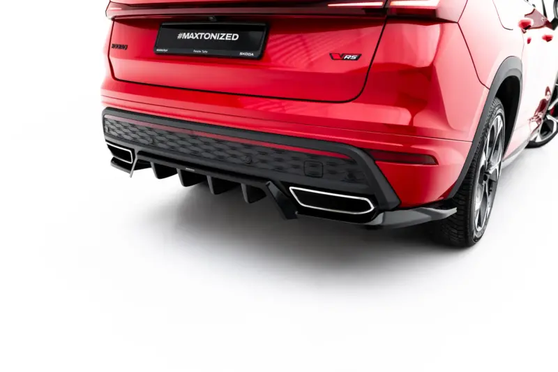 Rear view of a red car showing the VRS badge and a black, textured rear bumper against a white studio background.