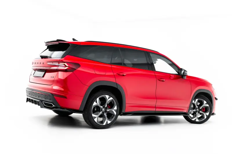 Red Skoda SUV shown from the rear-left side with taillights, roof rails, and large alloy wheels visible against a white background.