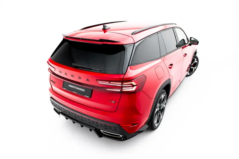 Red Skoda SUV viewed from rear-right, showcasing taillights, hatch, and alloy wheels against a white background, angled top-down.