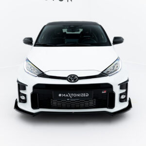 Front view of a white Toyota SUV in a studio, showing black grille and '#MAXTONIZED' license plate area at center