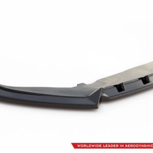 Dark gray automotive diffuser with multiple fins, shown on a white background; branding logo visible in the bottom right corner.